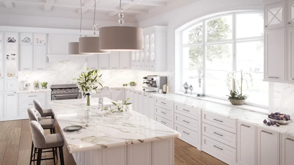 A large white kitchen with marble counter tops.