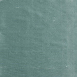 A close up of the fabric in a green color