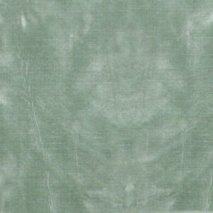 A green cloth with some white spots on it