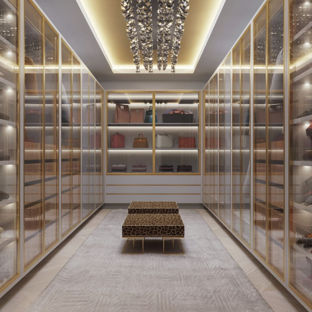 A large walk in closet with glass doors and shelves.