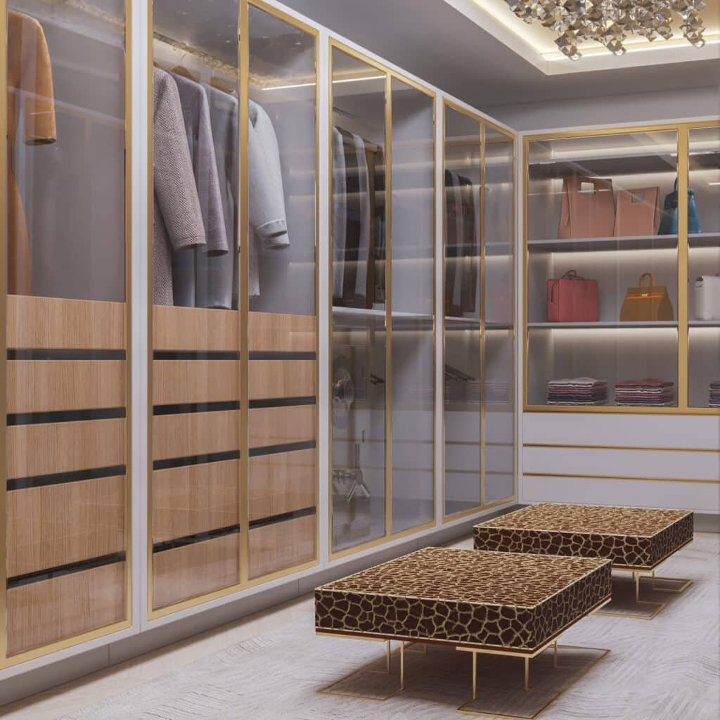 A walk in closet with two leopard print benches.