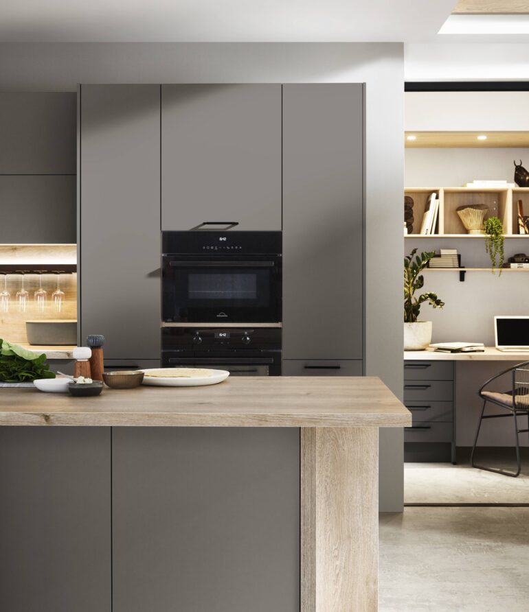 Modern kitchen with sleek cabinets and island.