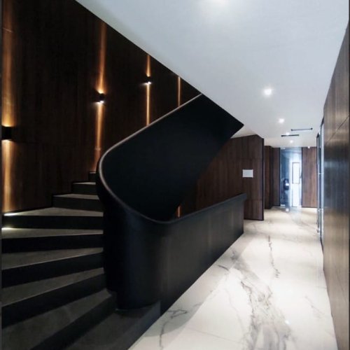In the modern law office, Calacatta Marmi Porcelain SinterClad slabs were skillfully utilized to create a stunning staircase.