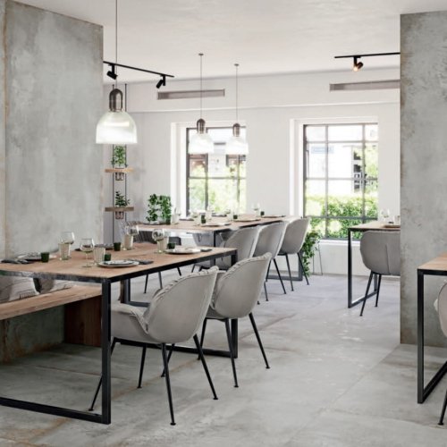 A captivating industrial-style restaurant with Downtown Los Angeles (DTLA) vibes, adorned with large SinterClad porcelain slabs.