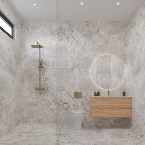The luxury guest bathroom, adorned with large-format porcelain slabs, offers a sophisticated, organic feel with clean, modern aesthetics
