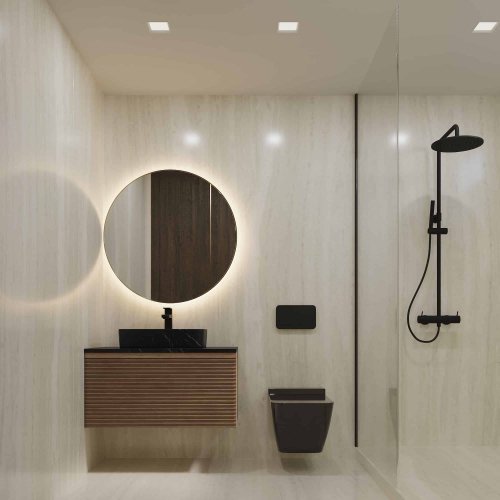 A bathroom with a sink, toilet and shower.